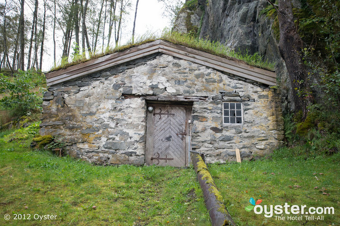 The historic property features plenty of quaint remains of its days as a farm, such as this smokehouse.