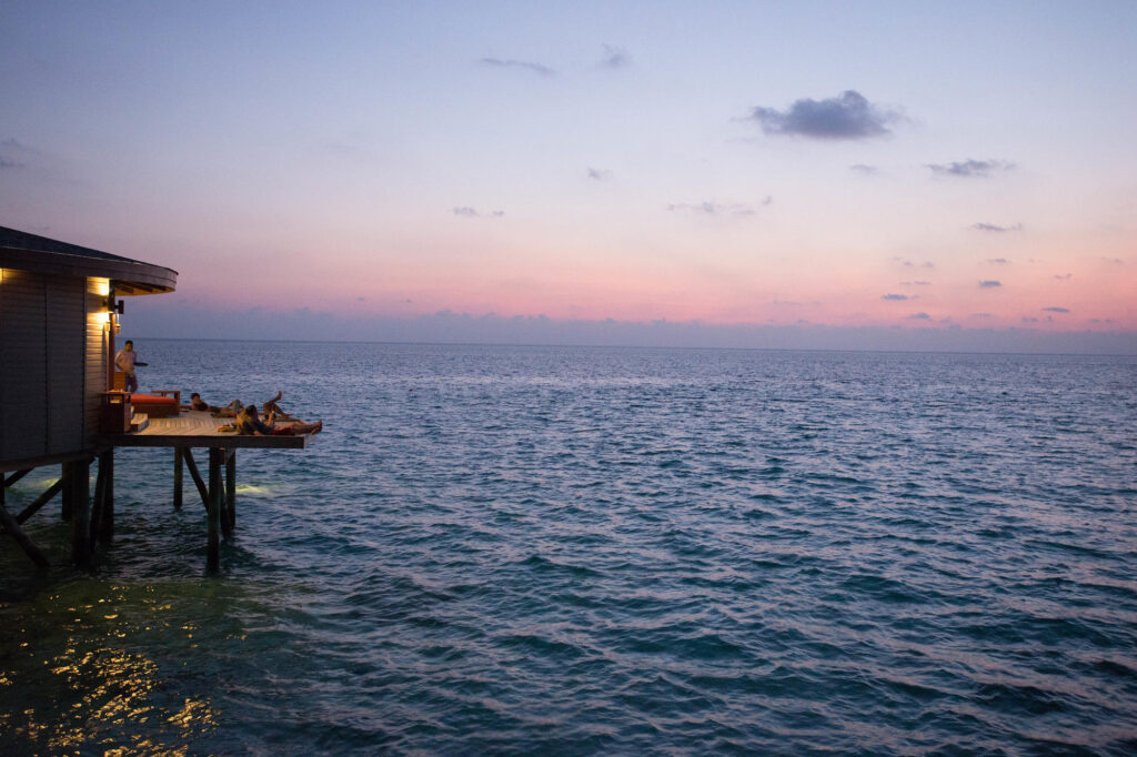 The Centara Ras Fushi Resort & Spa Maldives at sunset