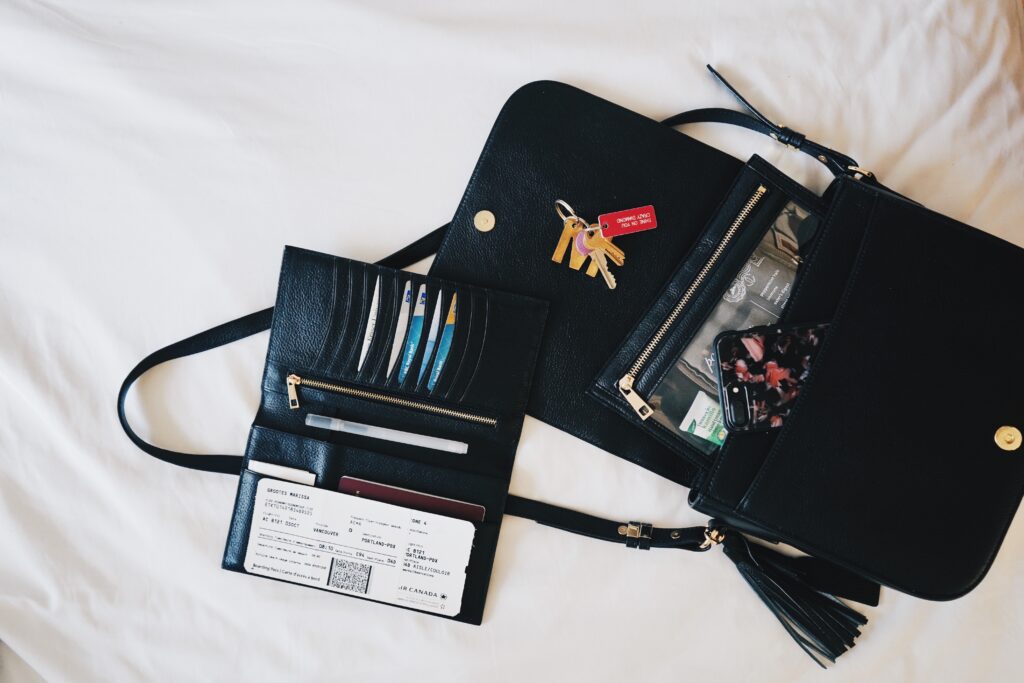 Purse with plane ticket and keys and phone