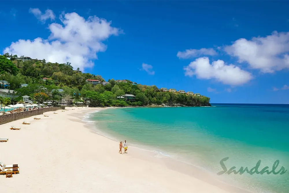 Win a St. Lucia Dream Getaway; Couple walking on the beach with clear blue water.